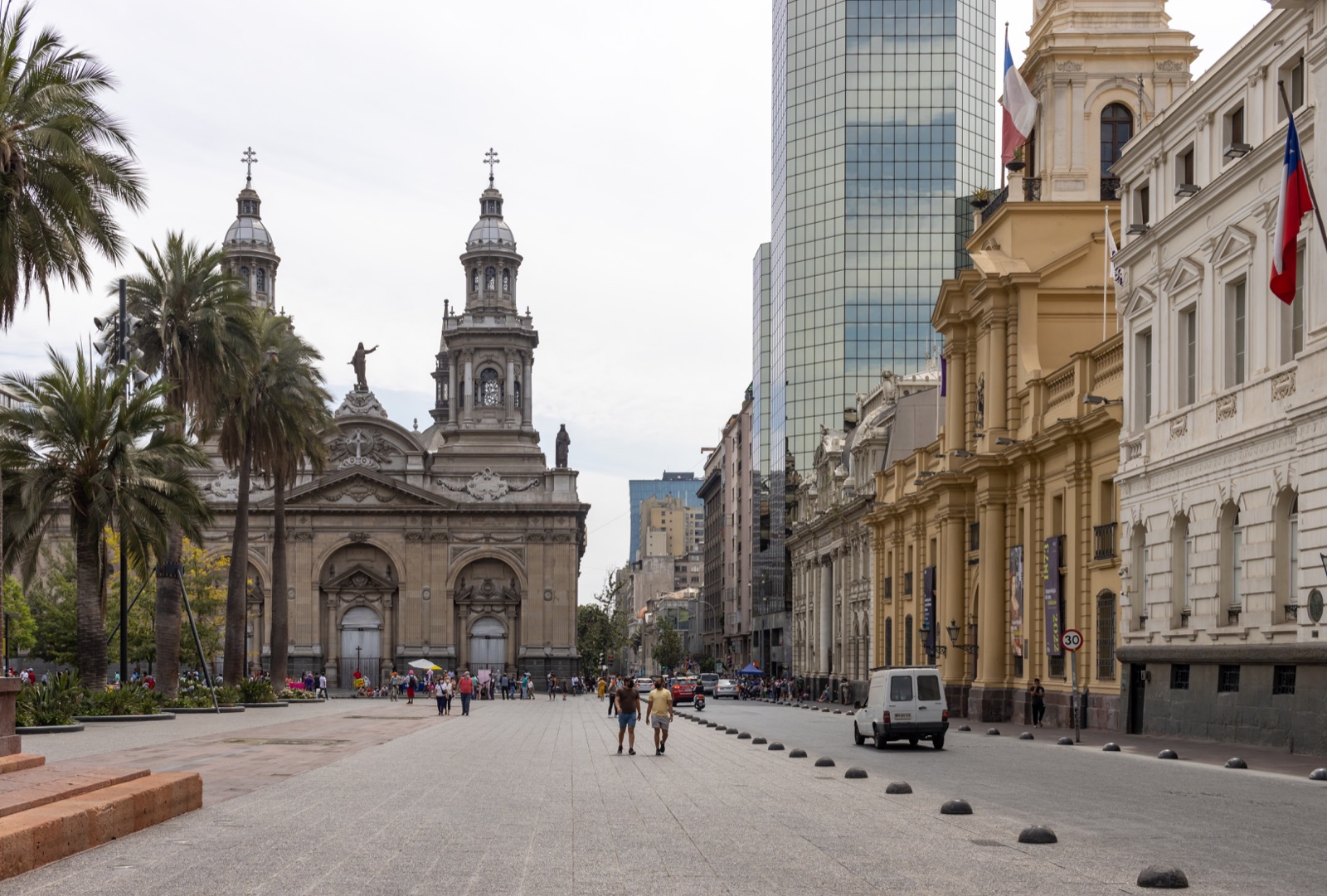 Santiago Metropolitan Cathedral and historic buildings beside Plaza de Armas in daylight